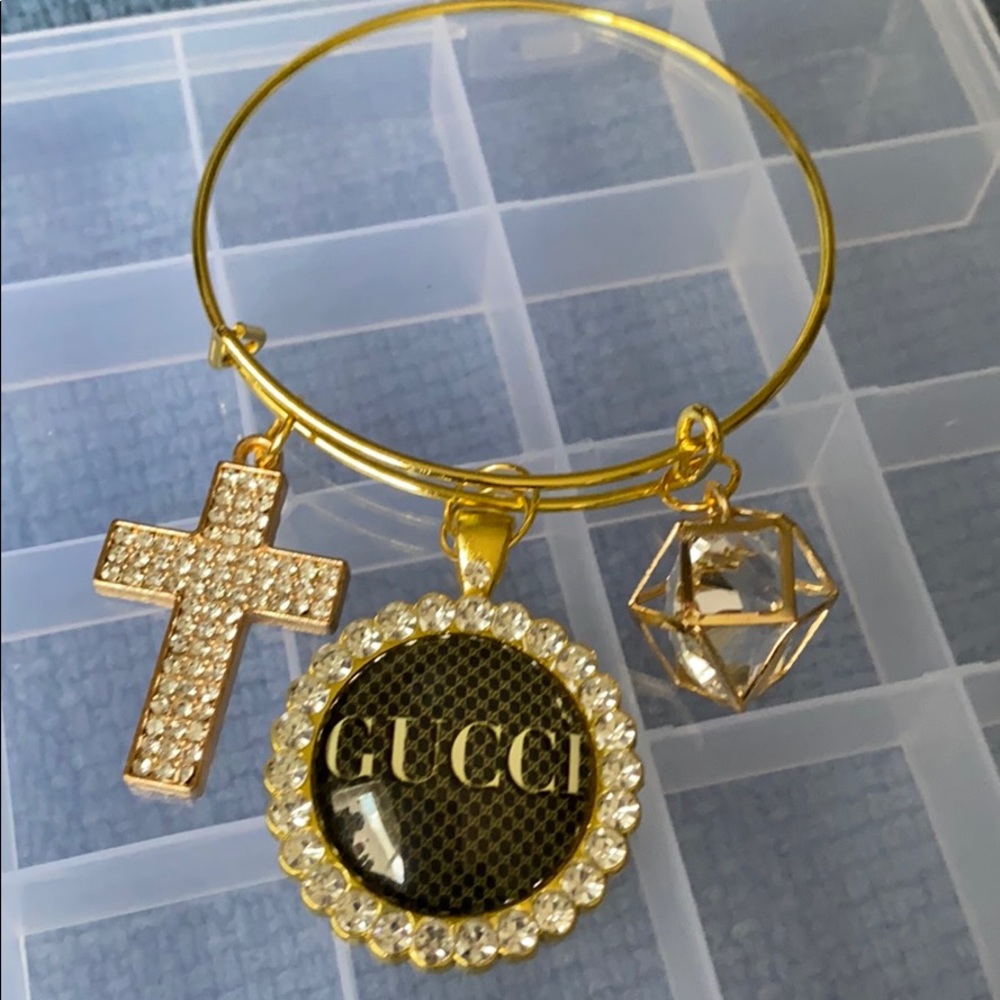 Gold plated bangle with charms
